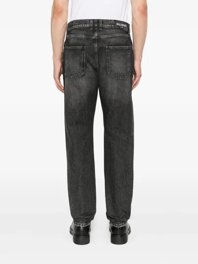 Balmain Jeans With Logo Appliqué In Black