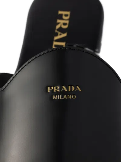 Prada Embossed-logo Leather Mules In Black