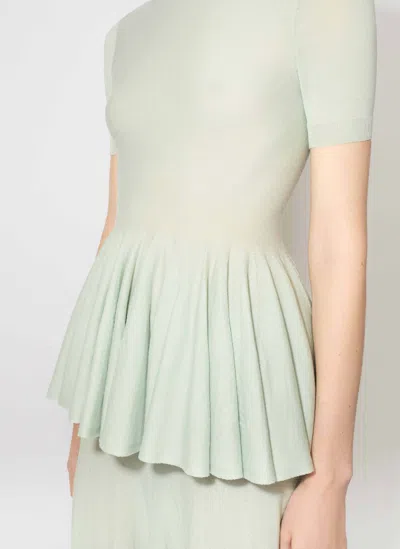 Alaïa Virgin Wool Peplum Top In Blue