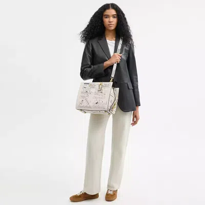 Coach X Peanuts Rogue Bag With Newspaper Print