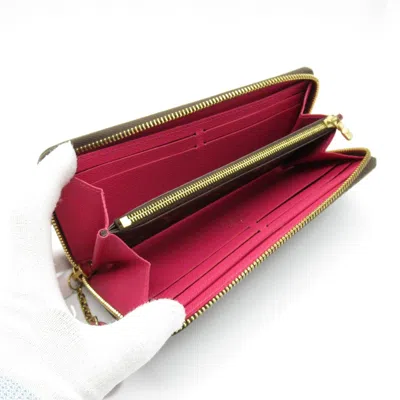 Pre-owned Louis Vuitton Brown Coated Canvas Monogram Pvc Long Wallet (bi-fold) ()