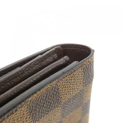 Pre-owned Louis Vuitton Damier Ebene Coated Canvas Long Wallet (bi-fold) () In Brown