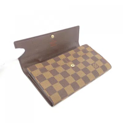 Pre-owned Louis Vuitton Damier Ebene Coated Canvas Long Wallet (bi-fold) () In Brown