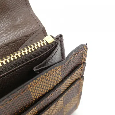 Pre-owned Louis Vuitton Damier Ebene Coated Canvas Long Wallet (bi-fold) () In Brown