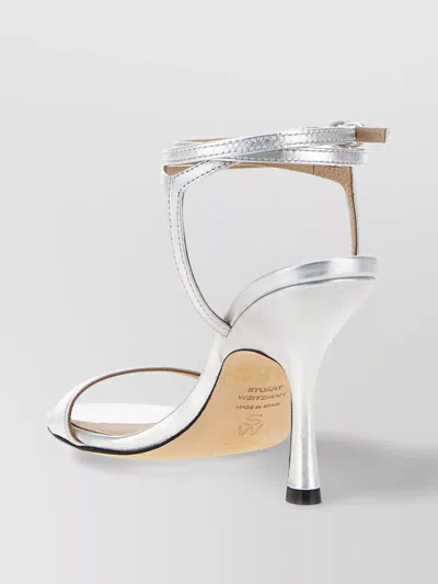 Stuart Weitzman Metallic Buckle Wrap Sandals In Silver