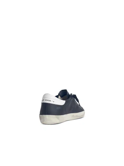 Golden Goose 'super-star' Black Low Top Sneakers With Logo Patch And Suede Details In Leather Man In Black