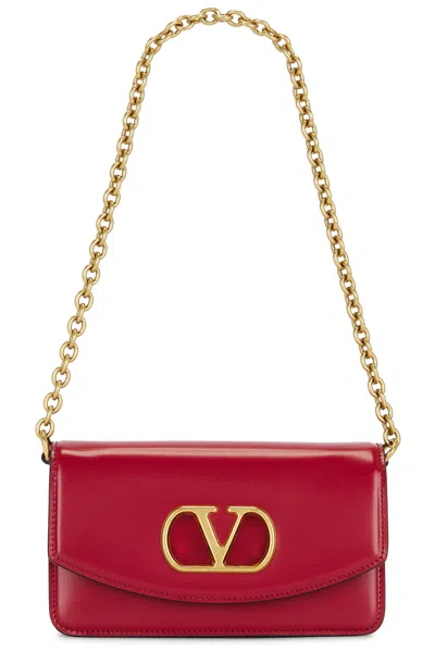 Valentino Garavani Vain Small Leather Clutch In Red