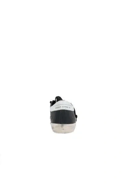 Golden Goose 'super-star' Black Low Top Sneakers With Logo Patch And Suede Details In Leather Man In Black