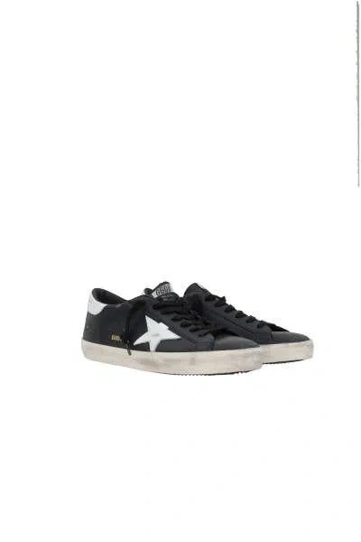 Golden Goose 'super-star' Black Low Top Sneakers With Logo Patch And Suede Details In Leather Man In Black