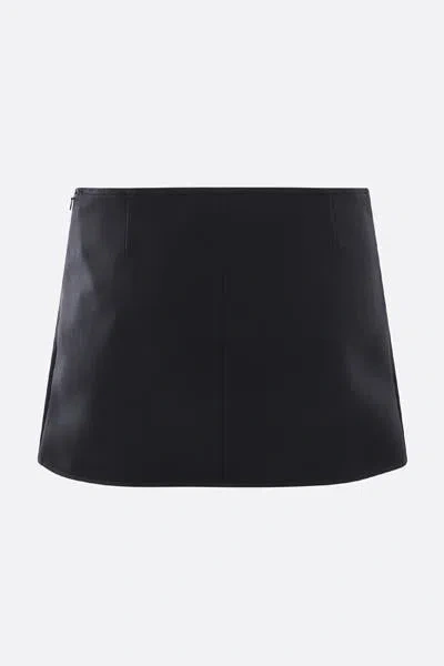 Courrèges Elegant Wrap Skirt With Belted Detail And Pocket Accents In Black