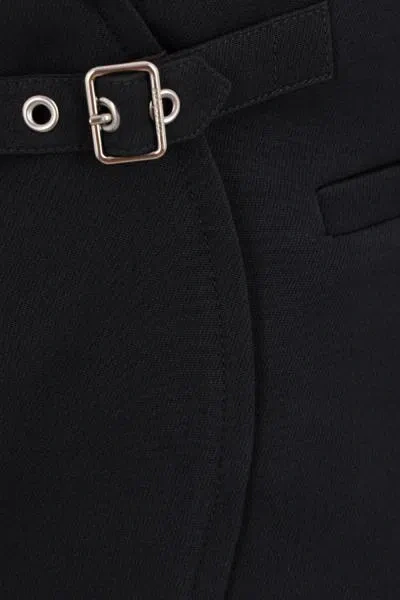 Courrèges Elegant Wrap Skirt With Belted Detail And Pocket Accents In Black