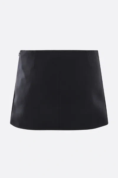 Courrèges Elegant Wrap Skirt With Belted Detail And Pocket Accents In Black
