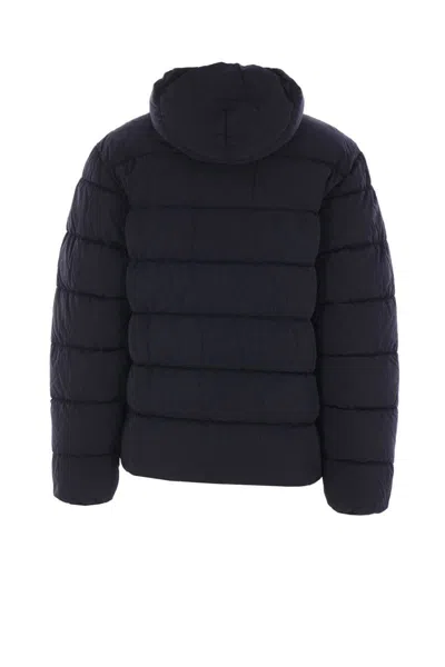 C.p. Company Blue Down Jacket With Fixed Hood And Logo Plaque On The Sleeve In Tech Fabric Man In Blue
