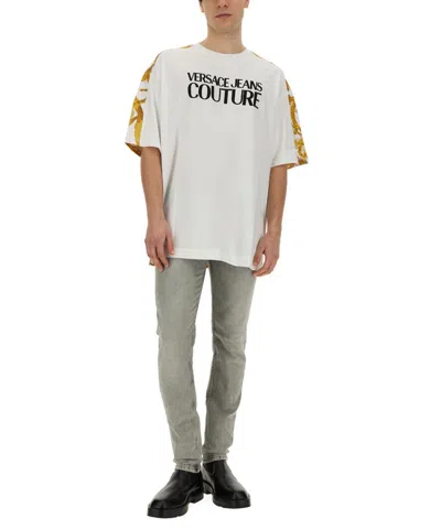Versace Jeans Couture Oversized T-shirt With Bold Logo And Intricate Patterned Sleeves In White