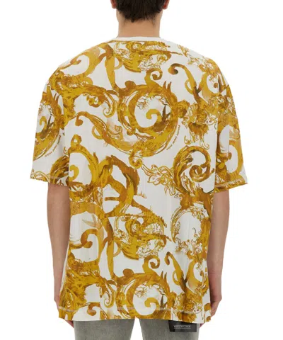 Versace Jeans Couture Oversized T-shirt With Bold Logo And Intricate Patterned Sleeves In White
