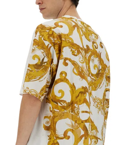 Versace Jeans Couture Oversized T-shirt With Bold Logo And Intricate Patterned Sleeves In White