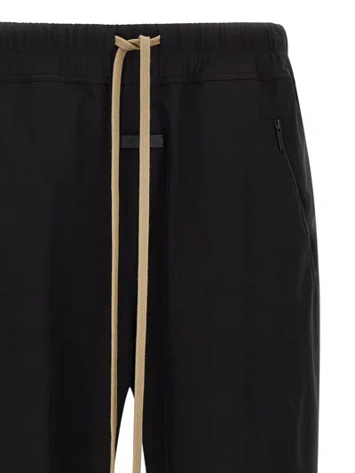 Fear Of God Elastic Waistband Trackpant Joggers With Side Zip Pockets In Black
