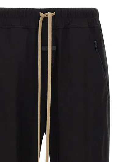 Fear Of God Elastic Waistband Trackpant Joggers With Side Zip Pockets In Black