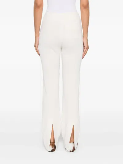 Nanushka Shera Back-slit Trousers In Neutral