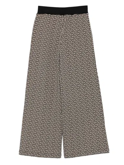 Balmain Monogram-pattern Trousers In Brown