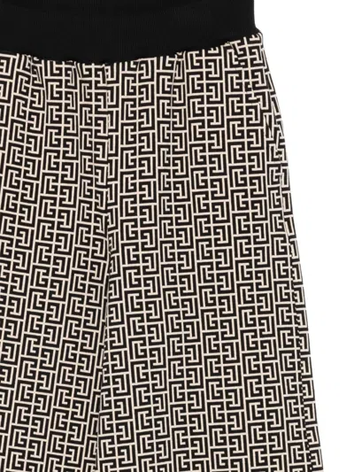Balmain Monogram-pattern Trousers In Brown