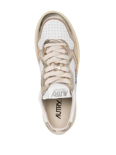 Autry Medalist Low Two-tone White Leather And Platinum Metallic Sneakers In Gold