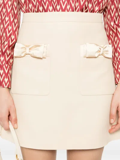 Valentino Bow-pocket Mini Skirt In Neutral