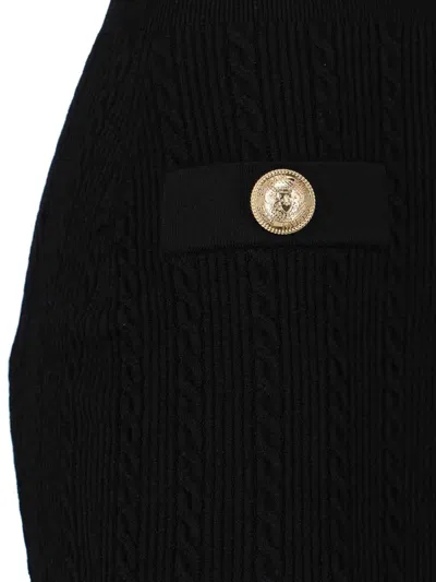Balmain Fitted Black Dress With Ribbed Texture And Gold Accents