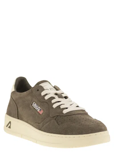 Autry Low-top Suede Sneakers With Rubber Sole And Lace-up Closure In Green