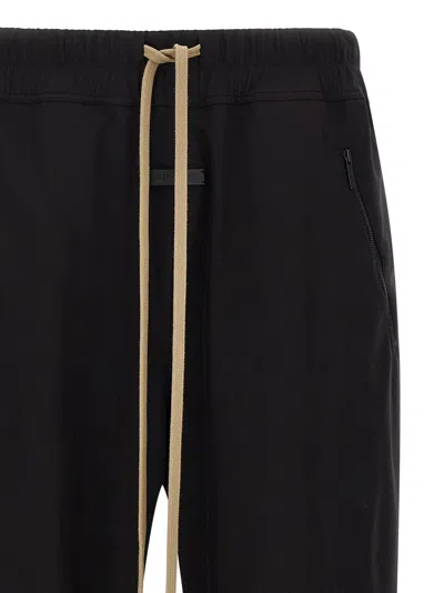 Fear Of God Elastic Waistband Trackpant Joggers With Side Zip Pockets In Black