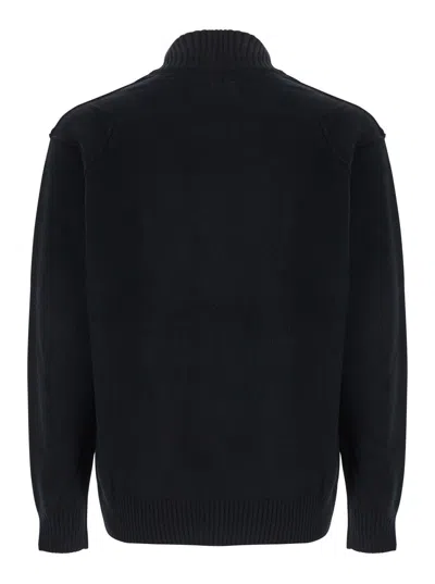 C.p. Company Black Jacket With High Neck And Logo Plaque On The Sleeve In Wool Blend Man In Black