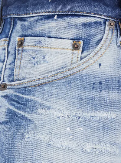 Dsquared2 Men Blue Jeans With Distressed Effect And Logo Patch On The Back In Denim Man In Blue