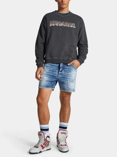Dsquared2 Men Blue Jeans With Distressed Effect And Logo Patch On The Back In Denim Man In Blue