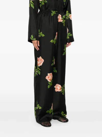 Nanushka Arvenn Rose-print Elastic-waist Trousers In Black