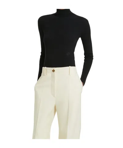 Patou Turtleneck Merino Knit Sweater In Black