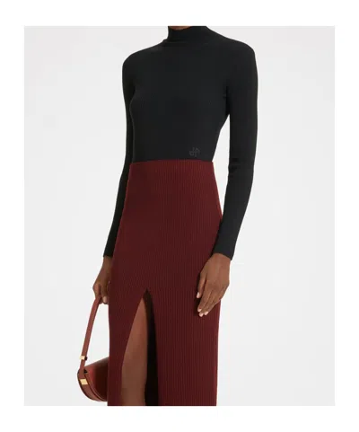 Patou Turtleneck Merino Knit Sweater In Black