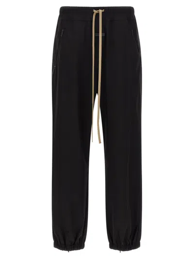 Fear Of God Elastic Waistband Trackpant Joggers With Side Zip Pockets In Black