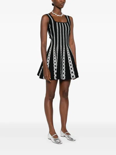 Maje Monogram-jacquard Mini Dress In Black