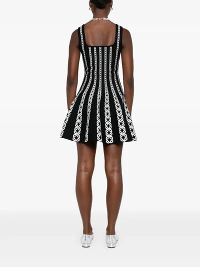 Maje Monogram-jacquard Mini Dress In Black