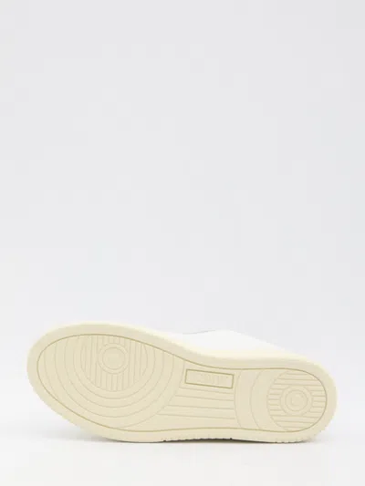 Autry Low-top Sneakers With Suede Accents And Golden Details