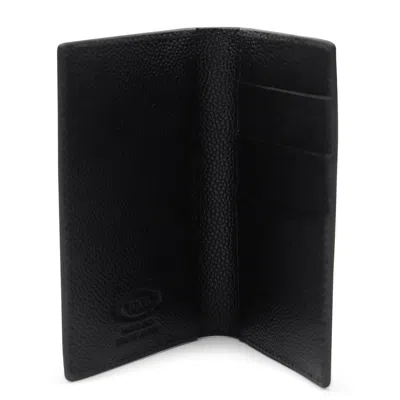 Tod's Textured Finish Wallets For A Sophisticated Look In Black
