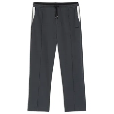 Hugo Boss Relaxed-fit Tracksuit Bottoms In Quilted Jacquard In Gray