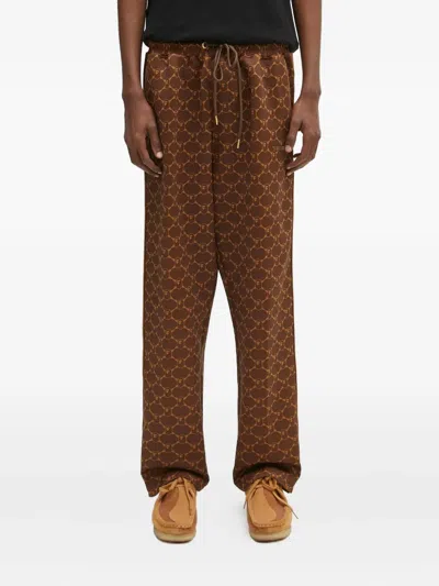 A Bathing Ape Logo-print Side-stripe Trousers In Brown
