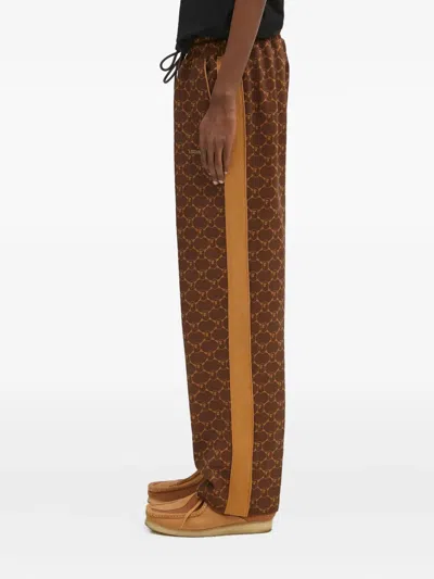 A Bathing Ape Logo-print Side-stripe Trousers In Brown