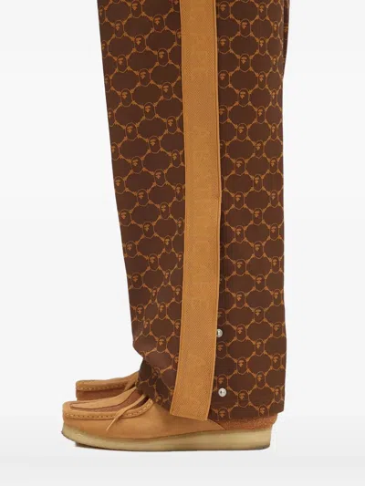 A Bathing Ape Logo-print Side-stripe Trousers In Brown