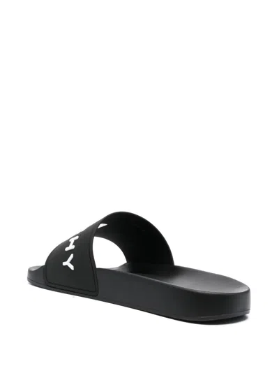 Givenchy Black Logo Embossed Slides In Black