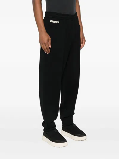Moschino Zip-pocket Cuffed Trousers In Black