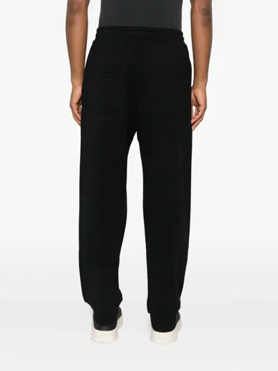 Moschino Zip-pocket Cuffed Trousers In Black