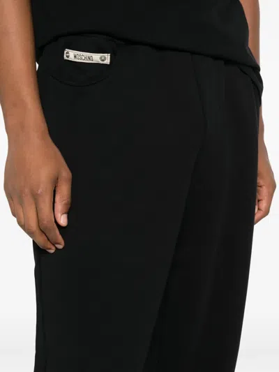 Moschino Zip-pocket Cuffed Trousers In Black
