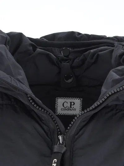 C.p. Company Blue Down Jacket With Fixed Hood And Logo Plaque On The Sleeve In Tech Fabric Man
